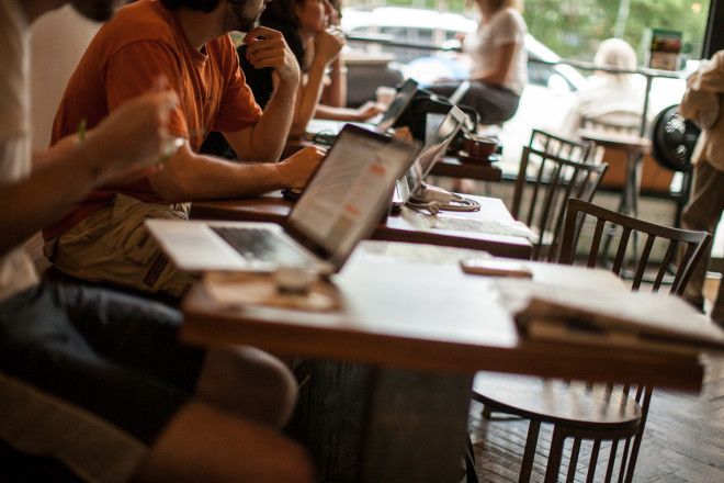   using laptop in coffee shop